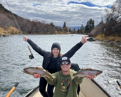 Colorado fly fishing guides with anglers showcasing rainbow trout on the river